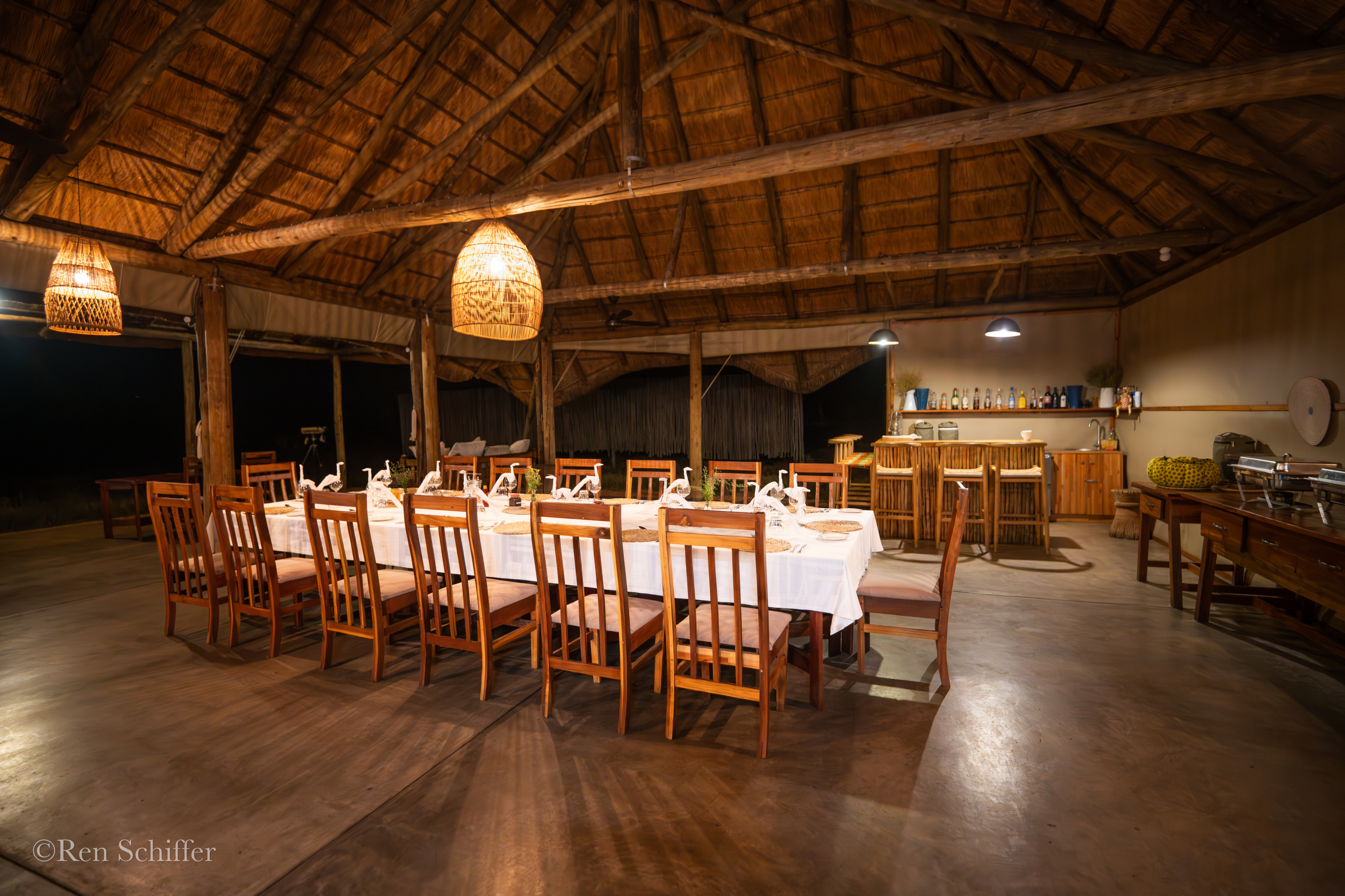 Safari lodge dining area set for dinner