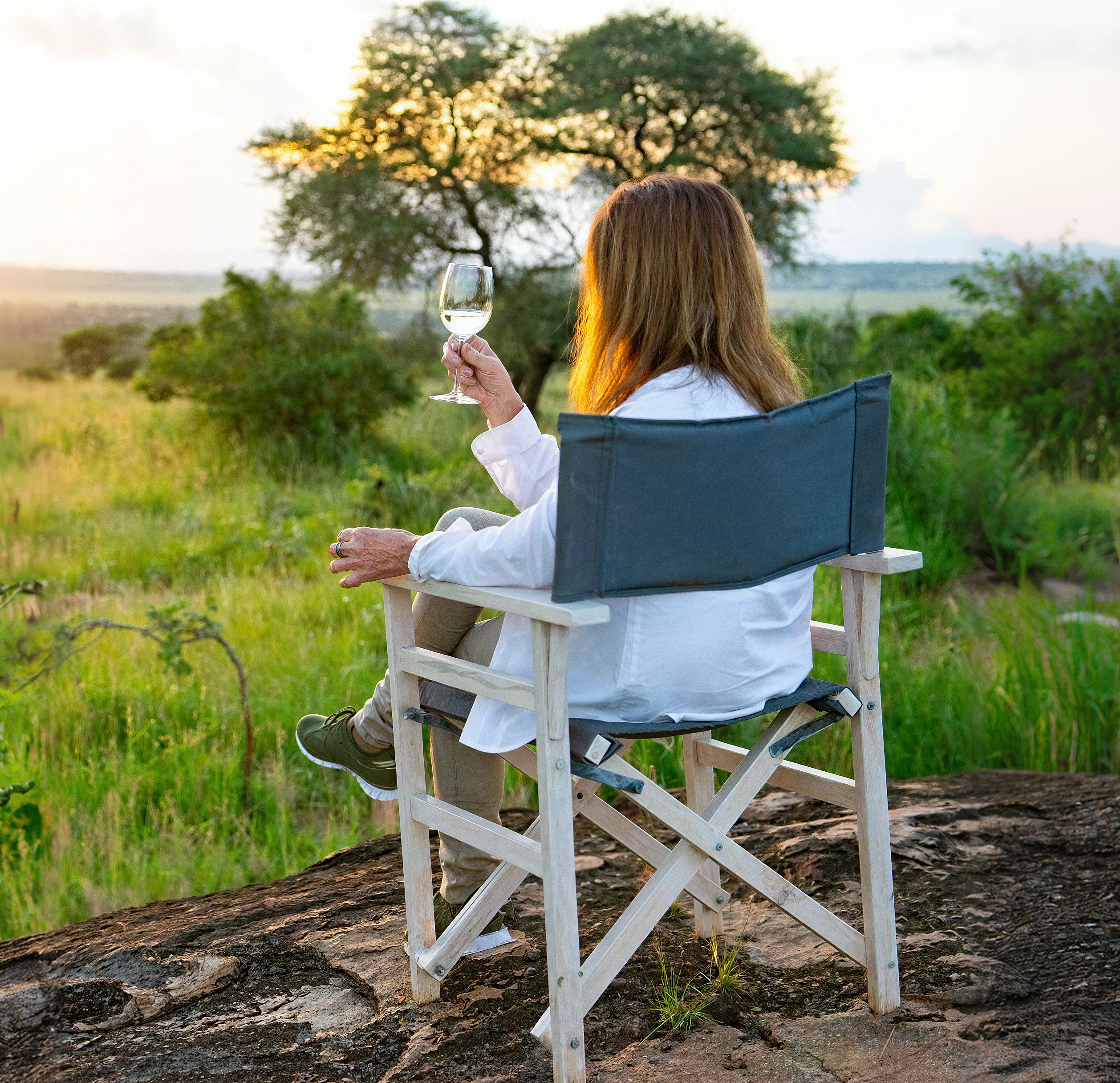 Guest enjoying a sundowner in the bush