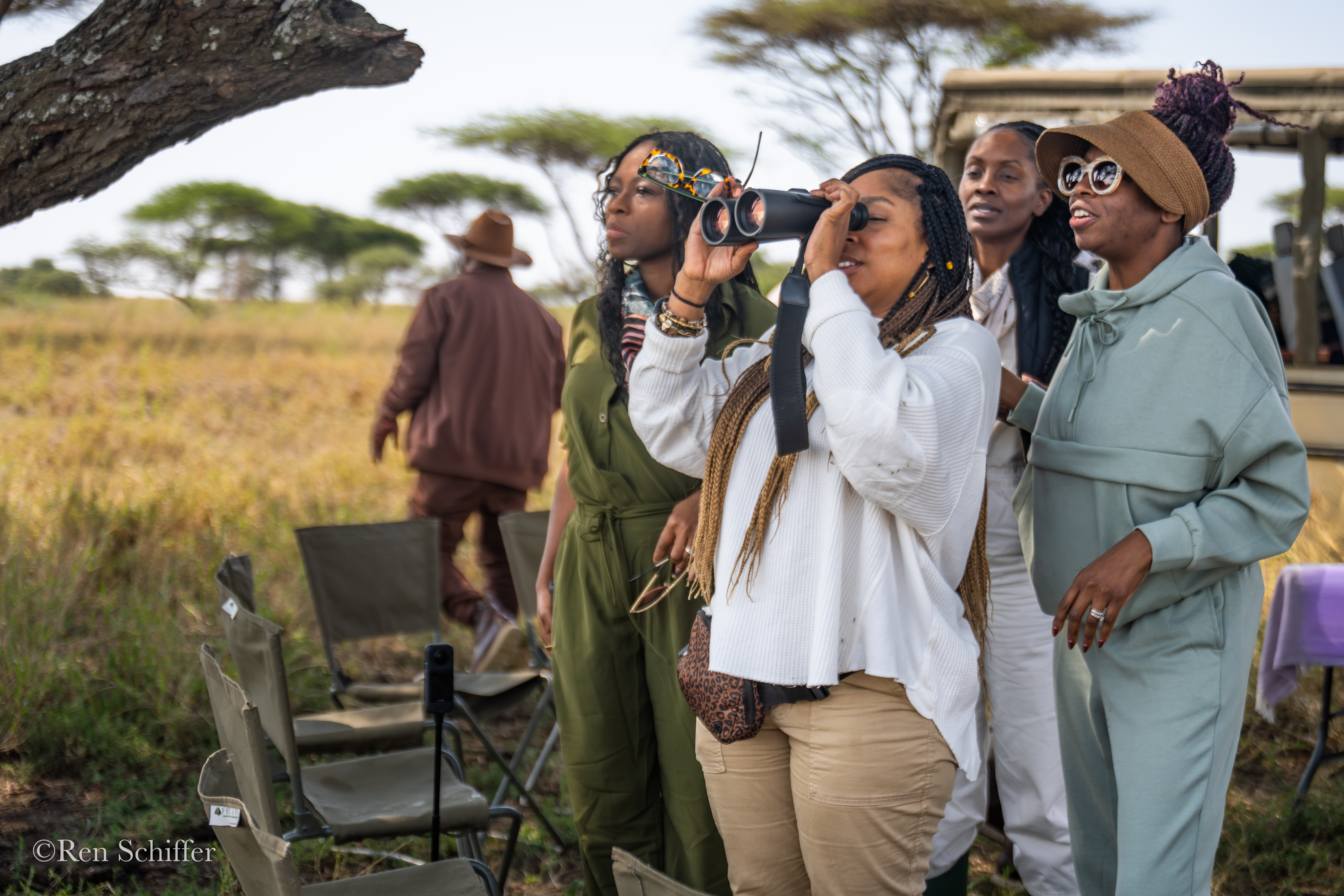 Family seated on a safari vehicle